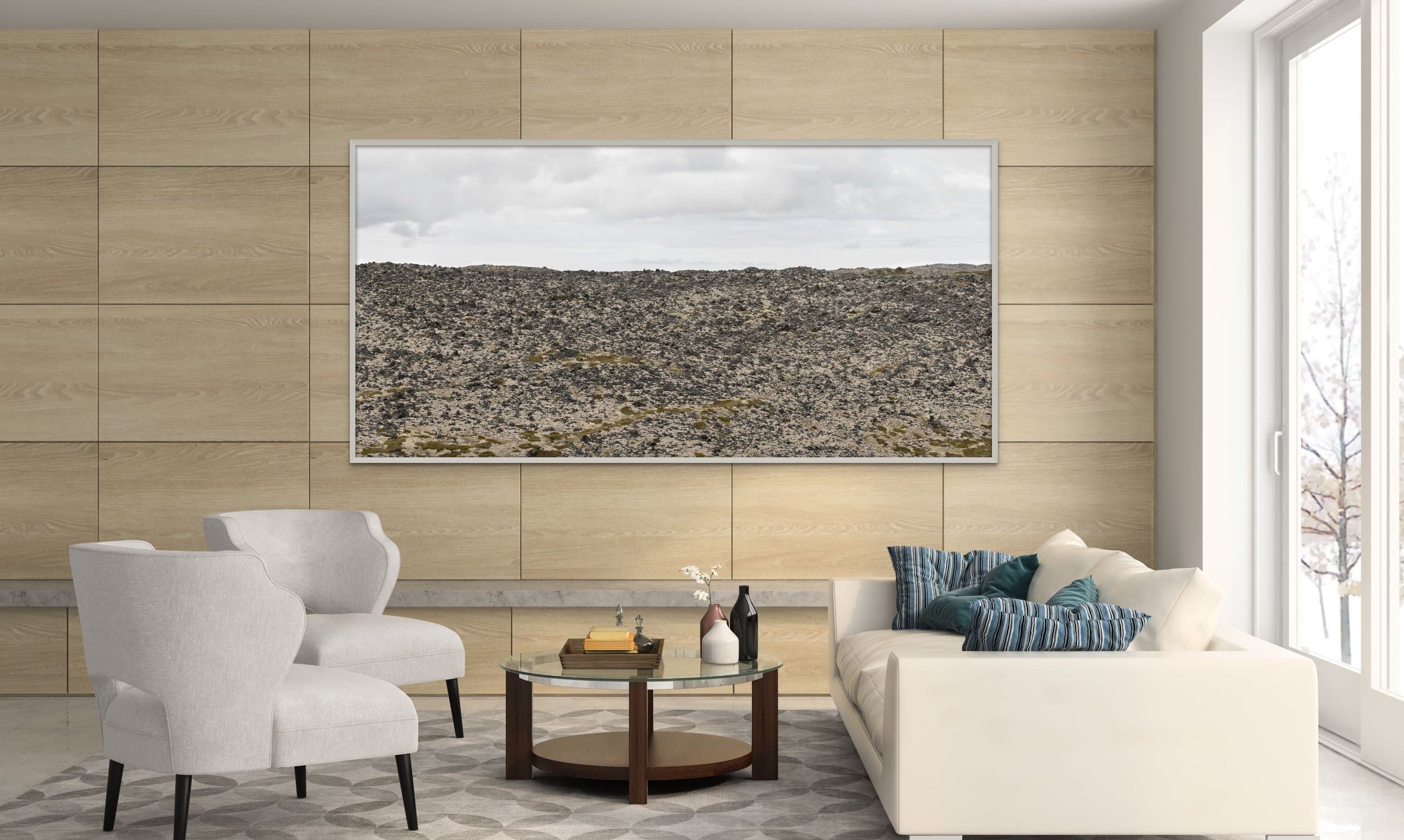 Photograph installed above a sofa in a living room